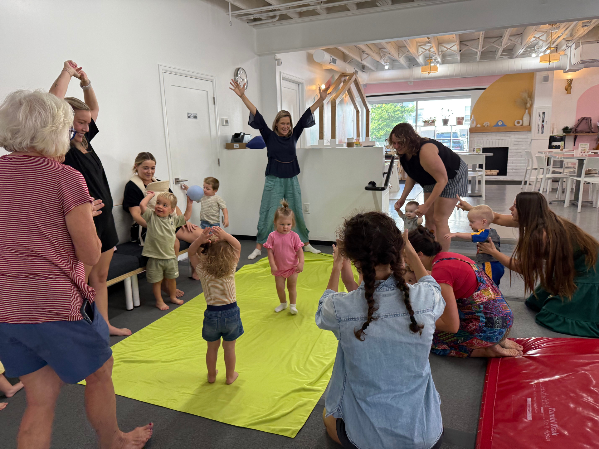 Toddler tumbling class with parachute and bubbles at tumble HAUS Denver