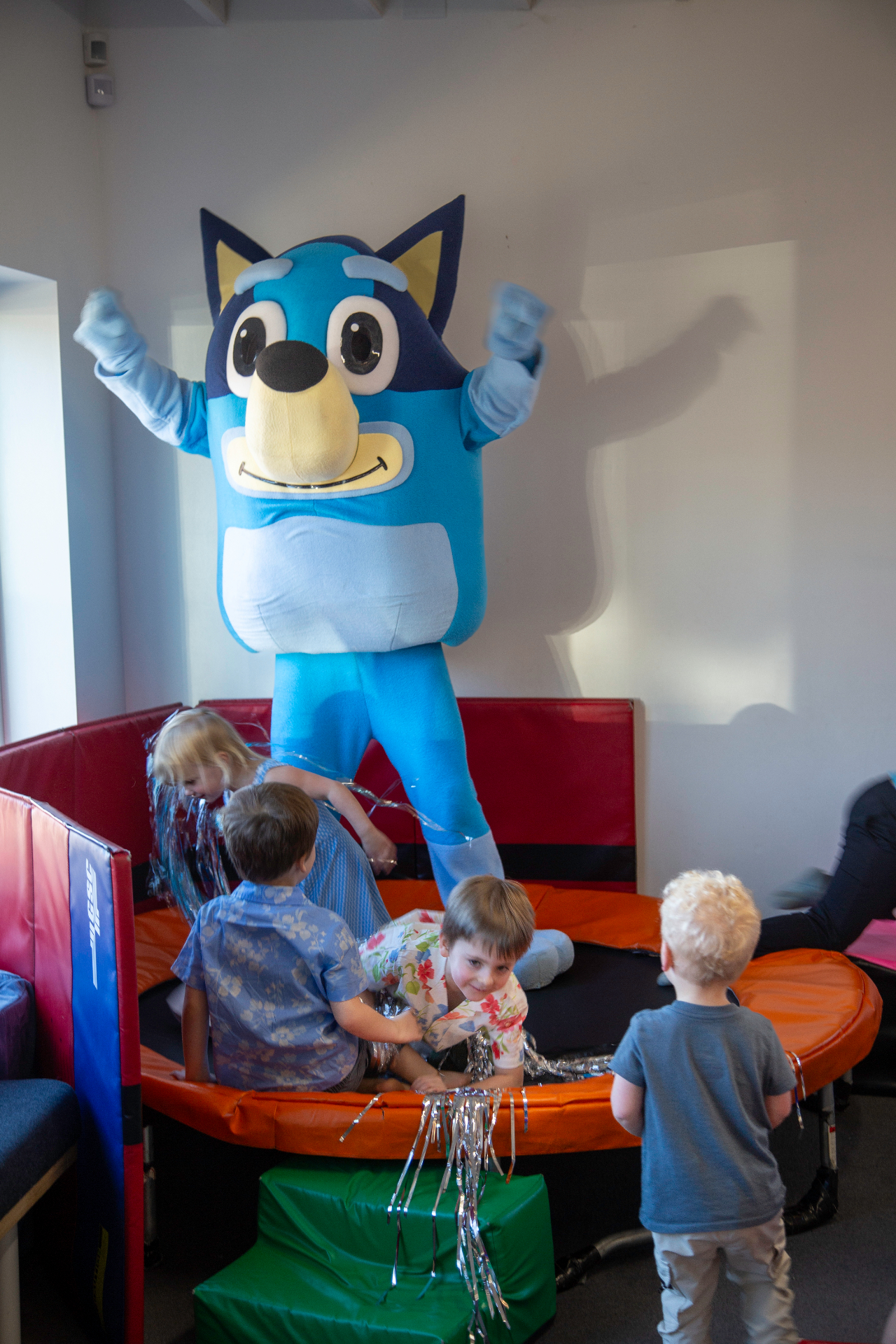 Bluey character mascot playing with kids at tumble HAUS in Denver