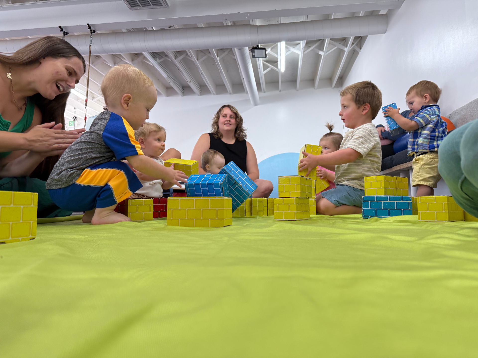 Children building with blocks at open tumble play in tumble HAUS Denver